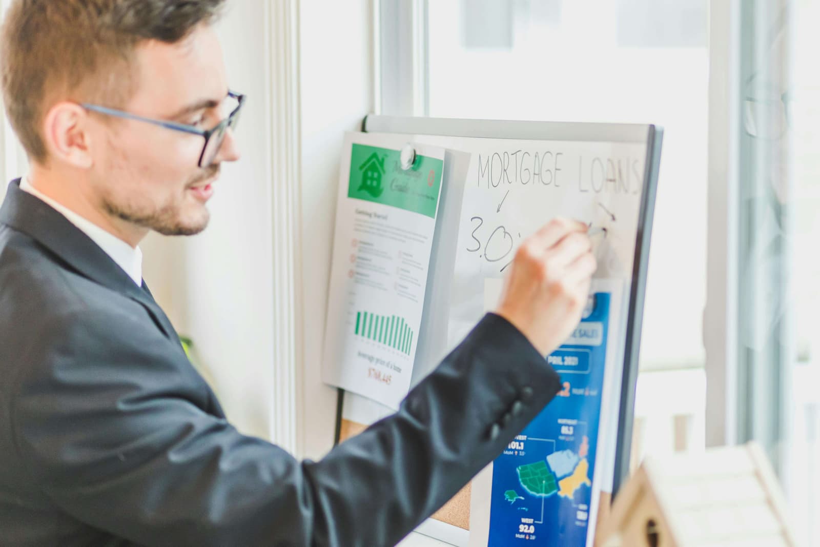Person comparing loan documents and offers with checklist